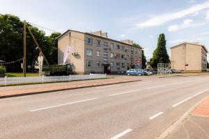 an empty street in front of a building at Marie` Apartment in Salme