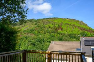 a view of a hill with a house at Maesteg Road - Large House - Sleeps 10 - Gateway to Afan Forest and Bike Trails in Dyffryn