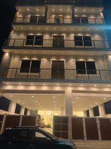 a building with a car parked in front of it at Kings Residency in Chennai +11 photos