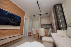 a living room with a table and a couch at Golem Escape in Kavajë