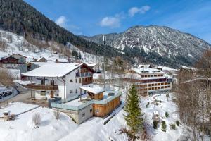 an aerial view of a resort in the snow at Ferienwohnung Gipfelstube in Brand