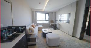 a living room with a couch and a table at Yanshan Hotel in Beijing