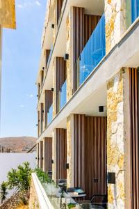 an external view of a building with windows at Sunrise Qeparo in Qeparo +32 photos