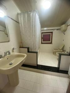 a bathroom with a sink and a toilet at Sole di Lercara in Lercara Friddi +23 photos