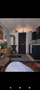 a living room with a kitchen with a table and a kitchen at Rowan retreat,Renwick, Penrith,CA10 1LA in Penrith