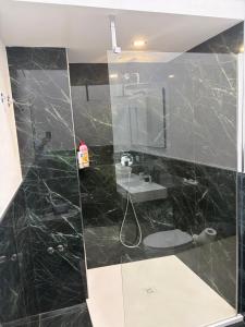 a bathroom with a shower and a sink at Suite Indipendenza Perugia in Perugia +2 photos