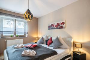 a bedroom with a bed with pillows on it at Eifel Dream Zingsheld in Fleringen