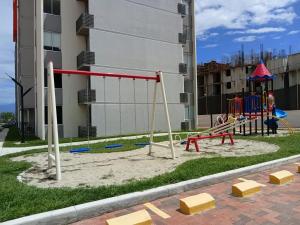 a playground in front of a building at Apartment Neiva Rasan in Neiva