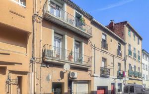 a building with balconies on the side of it at Le Troyes à Sète in Sète