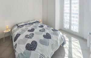 a bedroom with a bed with hearts on it at Le Troyes à Sète in Sète