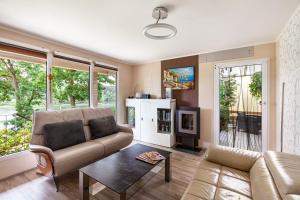 a living room with a couch and a table at Ferienhaus 257 in Zadelsdorf