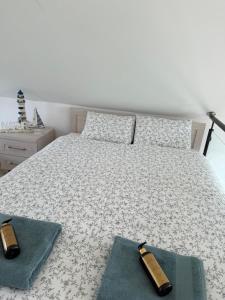 a bedroom with a bed with two pillows at Lazurowy Brzeg in Przejma Wielka +47 photos
