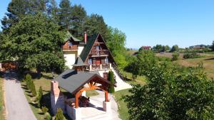 an overhead view of a house with a roof at Apartman Brezuljak Banja Luka Cokorska polja in Macanovići +37 photos