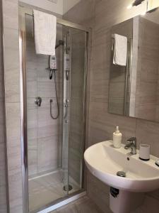 a bathroom with a shower and a sink at Casa Raffaella in Polignano a Mare +19 photos