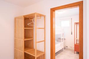a room with a book shelf and a mirror at Majordoms Ponent in Banyoles +28 photos
