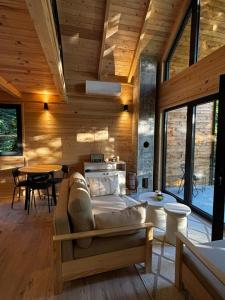 a living room with a couch and a table at Love Cabin in Slatina Varoš +21 photos