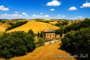 an aerial view of a house on a hill at Dimora Gentile BnB in Castiglione del Lago