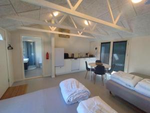 a living room with a couch and a table at Byhus Vejle in Vejle