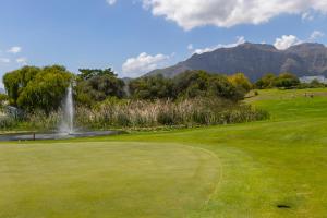 a view of a golf course with a fountain at Winelands Golf Lodges 28 in Stellenbosch