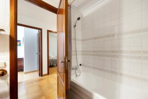 a bathroom with a shower and a bath tub at Vives Ref 9002 in Cala Bona +24 photos