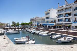 a group of boats are docked in a marina at Vives Ref 9002 in Cala Bona