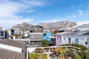 a view of the city with mountains in the background at Purple House Accommodations in Cape Town