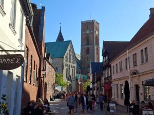 a group of people walking down a city street at Frifelt Kro Almost Glamping telt in Frifelt
