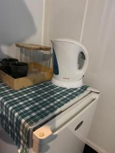 a blender sitting on top of a table at AB Accomodation in Palmerston North