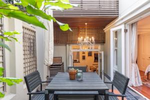 a dining room with a table and chairs at Purple House Accommodations in Cape Town