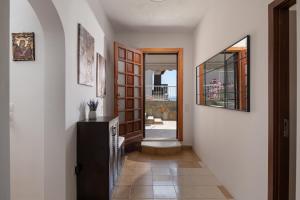 a hallway with a door leading into a house at Silvia's Haus in Neos Marmaras +32 photos
