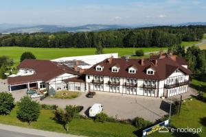 an aerial view of a large building with a large yard at Hotel Metro in Kłodzko