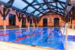 a group of people in a swimming pool at Ferienwohnungen Am Bühlwald in Eibenstock