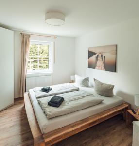 a bedroom with a large bed with a wooden frame at Schneekäppchen 2 in Winterberg