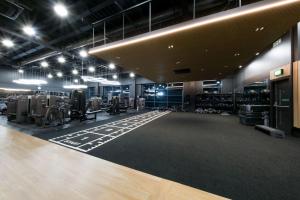 a room with a gym with a lot of equipment at Village Hotel London Watford in Elstree