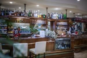 a bar filled with lots of bottles and bottles of liquor at Hotel Excelsior in Bibione