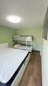 a room with a bed and shelves in it at LE VOLPI Marilleva 1400 in Marilleva +20 photos