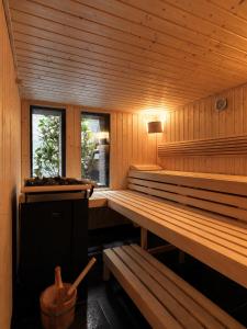 a sauna with two benches and two windows at Sense Hotel Sofia, a Member of Design Hotels in Sofia +56 photos