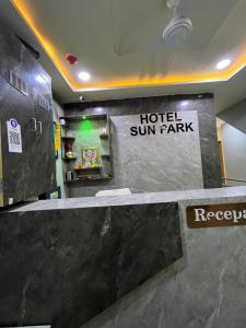 a hotel sun park sign in a hotel room at Hotel Sun Park in Ahmedabad