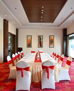 a large conference room with a long table and chairs at Red Fox by Lemon Tree Hotels, Alwar in Alwar