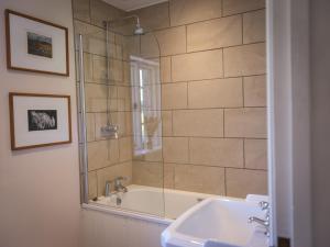 a bathroom with a shower and a sink at Lower Colworth Lodge in Chichester +20 photos