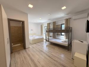 a room with two bunk beds in it at Greenstone Land - Corbu in Năvodari
