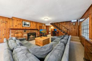 a living room with a couch and a fireplace at 3664 Birch Avenue cabin in South Lake Tahoe
