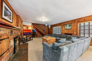 a living room with a couch and a fireplace at 3664 Birch Avenue cabin in South Lake Tahoe