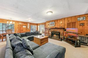 a living room with a couch and a fireplace at 3664 Birch Avenue cabin in South Lake Tahoe