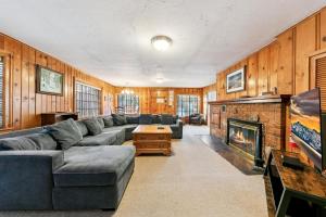 a living room with a couch and a fireplace at 3664 Birch Avenue cabin in South Lake Tahoe