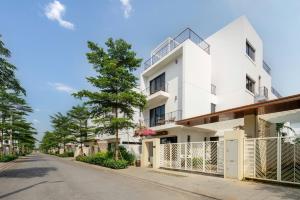an image of a white building on a street at Sunrise Villa BT09-A02 Vlasta Sam Son in Trương Tần