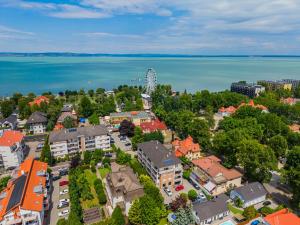 an aerial view of a town with the water at AH-Corso Wellness Apartment in Siófok