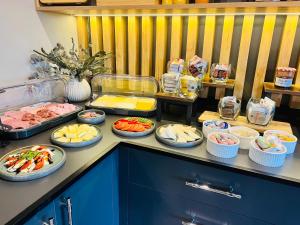 a buffet with many plates of food on a counter at Wöllbacher Tor in Wetzlar