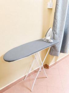 a table with a pair of scissors on top of it at HM SweetRest HOTEL in Changlun