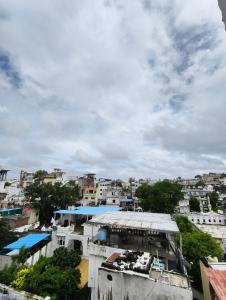 an overhead view of a city with buildings at Hotel Lake Star Bistro in Udaipur